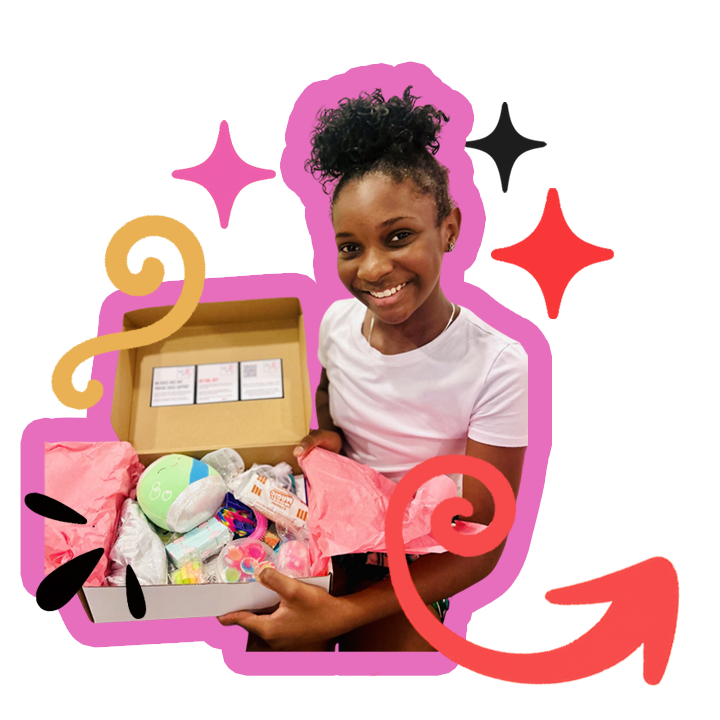 Young Black girl holding a mental health care package from MH Boxes